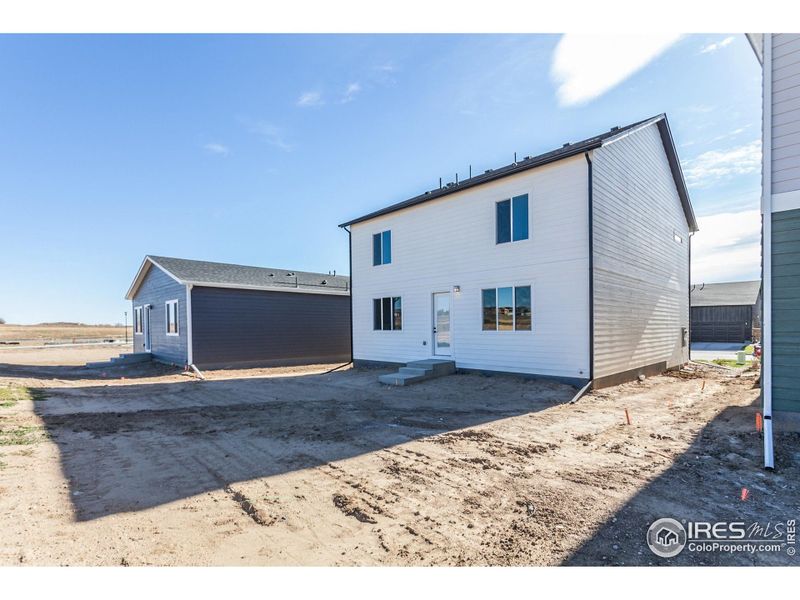 Exterior details and patio area of a home in Bloom Trailblazer Collection - Single Family Homes, Fort Collins (Image 3).