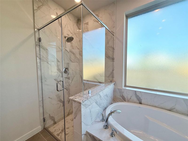 Freestanding Shower with beautiful tile to the ceiling