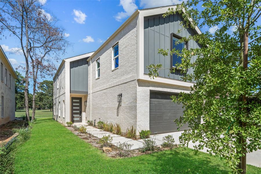 Front exterior of a new home in , Montgomery, TX, highlighting curb appeal (Image 2).