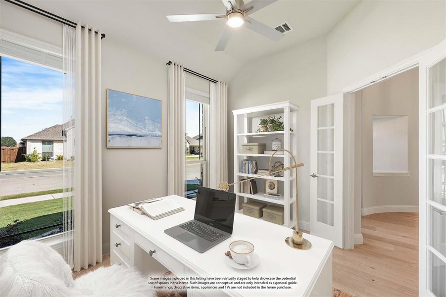 Home office with white desk, built-in shelving, ceiling fan, and French doors on hardwood floors Home office with white desk, built-in shelving, ceiling fan, and French doors on hardwood floors