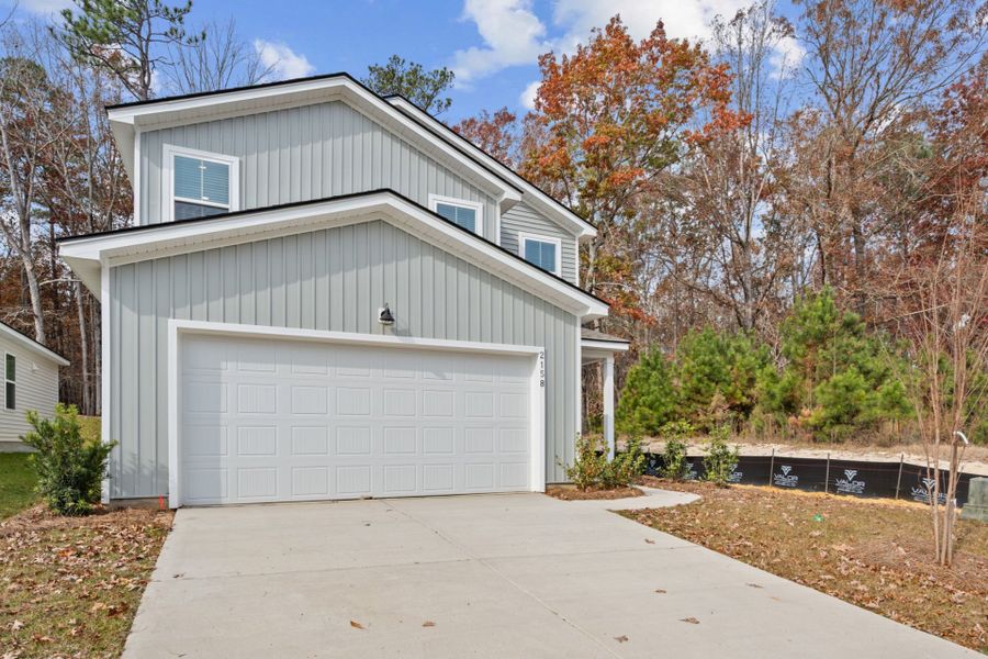 Front exterior of a new home in Grand Arbor, Blythewood, SC, highlighting curb appeal (Image 19).