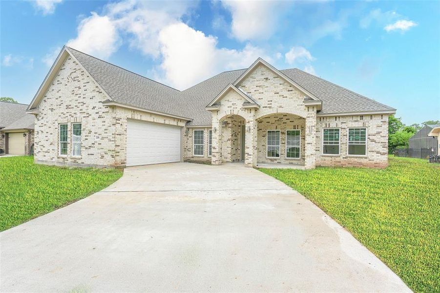 Front exterior of a new home in , West Columbia, TX, highlighting curb appeal (Image 26). Front exterior of a new home in , West Columbia, TX, highlighting curb appeal (Image 26).