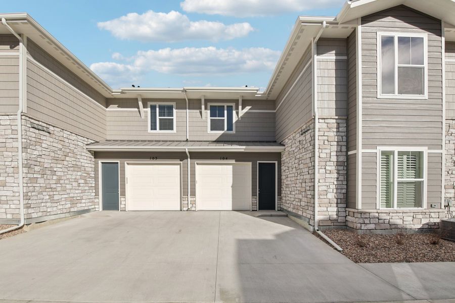 Exterior details and patio area of a home in Highlands at Fox Hill, Longmont (Image 3).