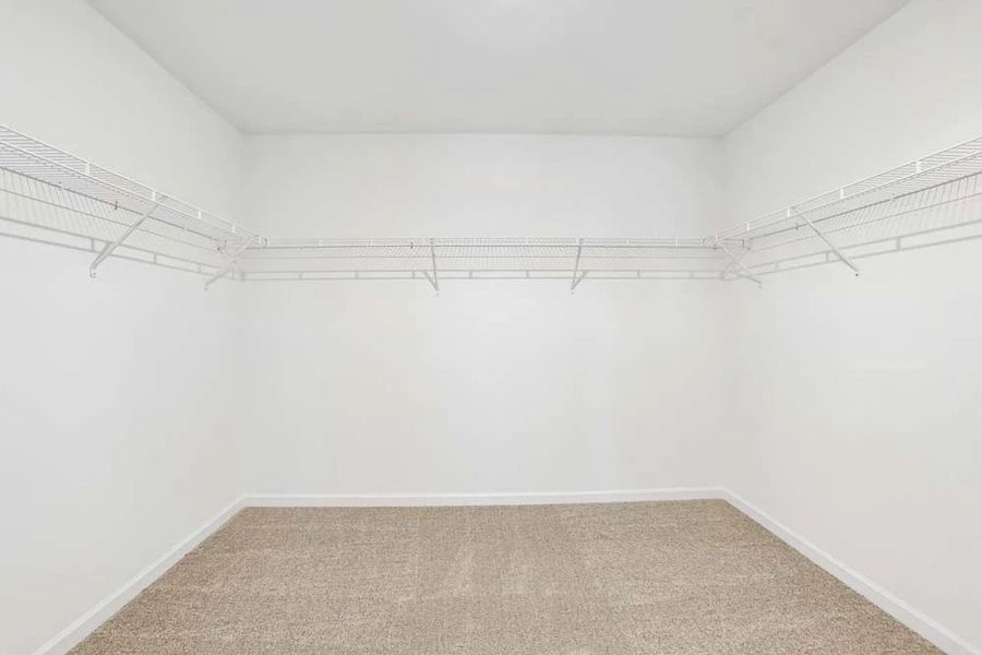 Sample Photo: Primary Bedroom Walk-In Closet Sample Photo: Primary Bedroom Walk-In Closet