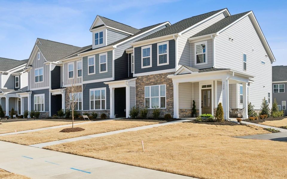 Front exterior of a new home in Wendell Falls, Wendell, NC, highlighting curb appeal (Image 20). Front exterior of a new home in Wendell Falls, Wendell, NC, highlighting curb appeal (Image 20).