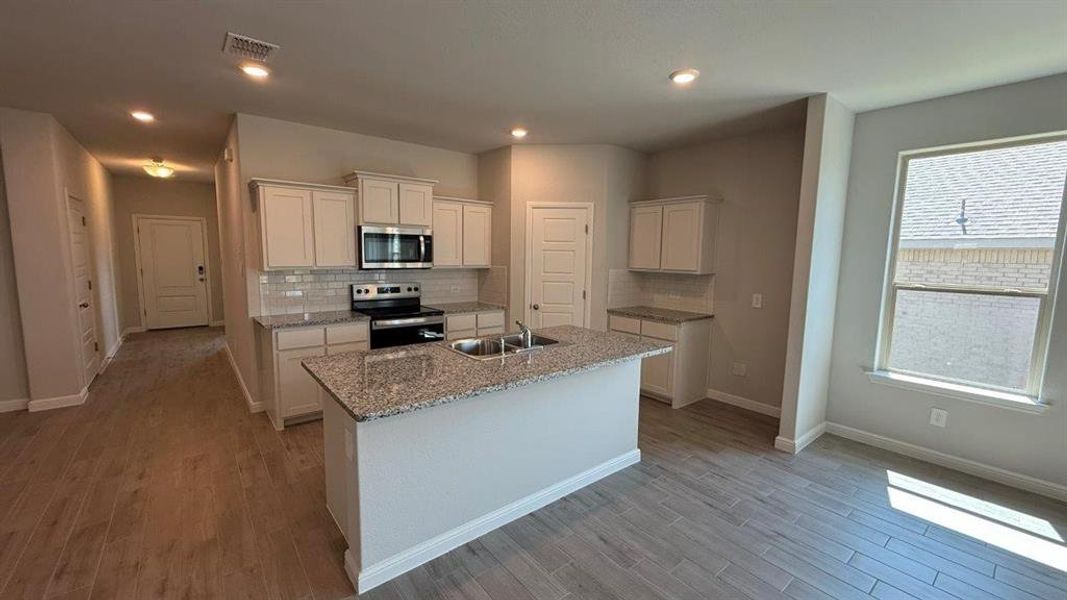 Kitchen - All Home and community information, including pricing, included features, terms, availability and amenities, are subject to change at any time without notice or obligation. All Drawings, pictures, photographs, video, square footages, floor plans, elevations, features, colors and sizes are approximate for illustration purposes only and will vary from the homes as built. Kitchen - All Home and community information, including pricing, included features, terms, availability and amenities, are subject to change at any time without notice or obligation. All Drawings, pictures, photographs, video, square footages, floor plans, elevations, features, colors and sizes are approximate for illustration purposes only and will vary from the homes as built.