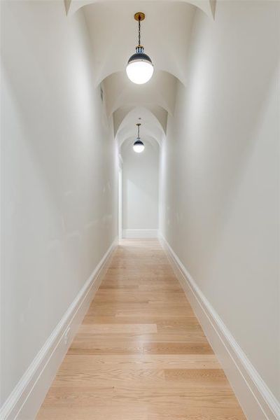 Hall with hardwood / wood-style flooring