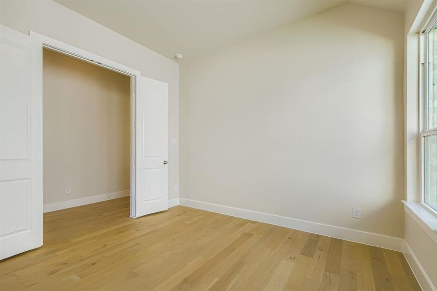Empty room featuring light wood-style flooring