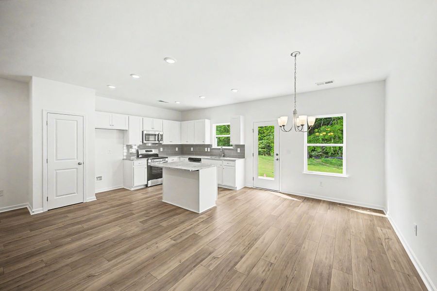 Kitchen with an island and separate dining space.