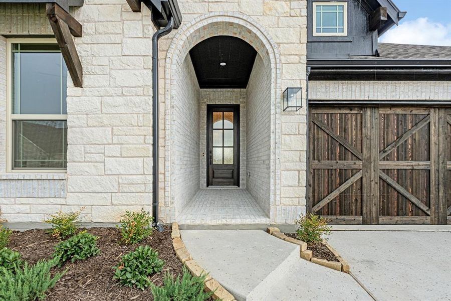 Front exterior of a new home in Painted Tree Woodland District 50, McKinney, TX, highlighting curb appeal (Image 23). Front exterior of a new home in Painted Tree Woodland District 50, McKinney, TX, highlighting curb appeal (Image 23).