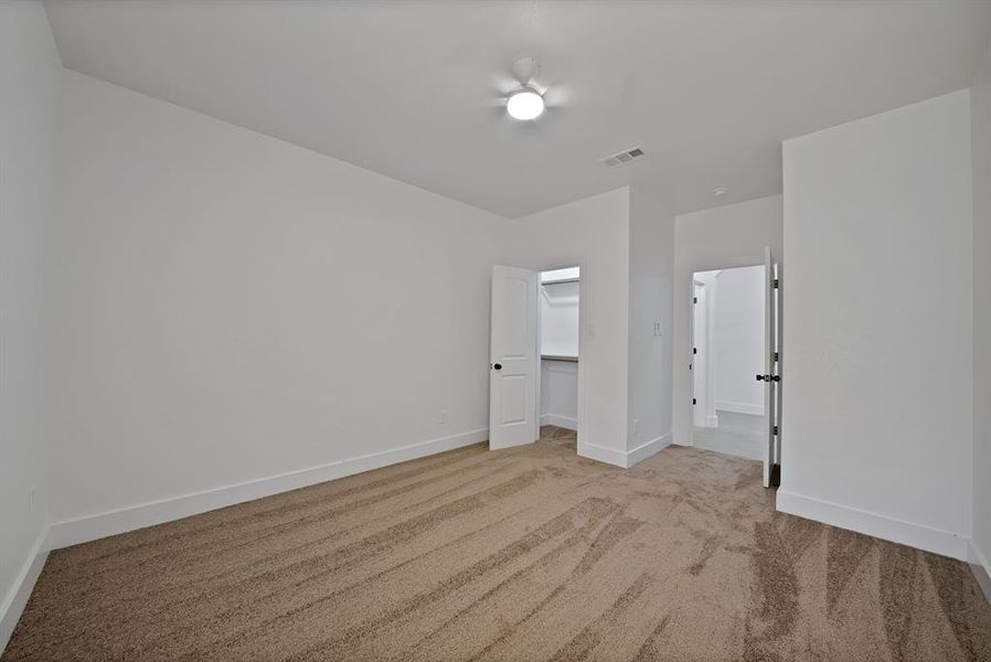 #2 bedroom featuring spacious closet