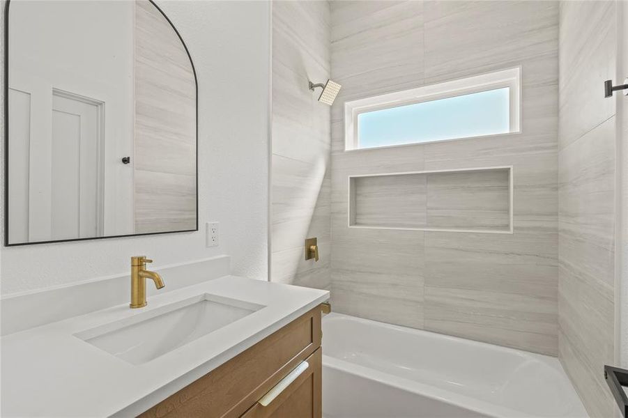 Bathroom featuring shower / bathtub combination and vanity