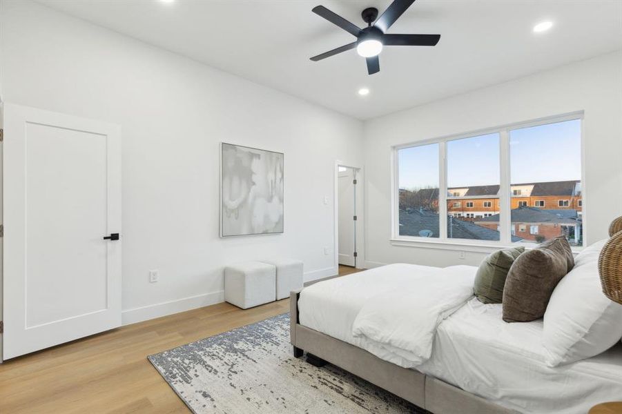 Bedroom with recessed lighting, light wood-style flooring, a ceiling fan, and baseboards