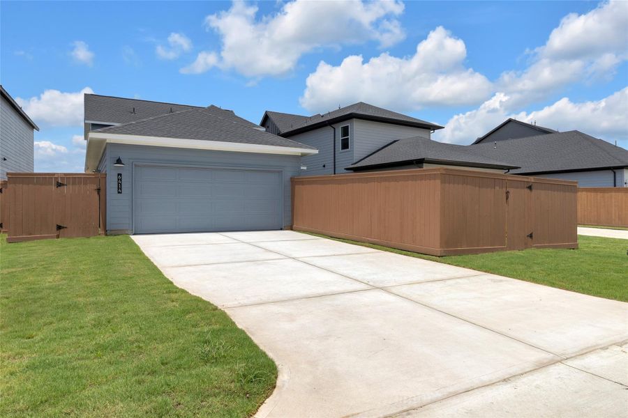 Front exterior of a new home in Elyson, Katy, TX, highlighting curb appeal (Image 27).