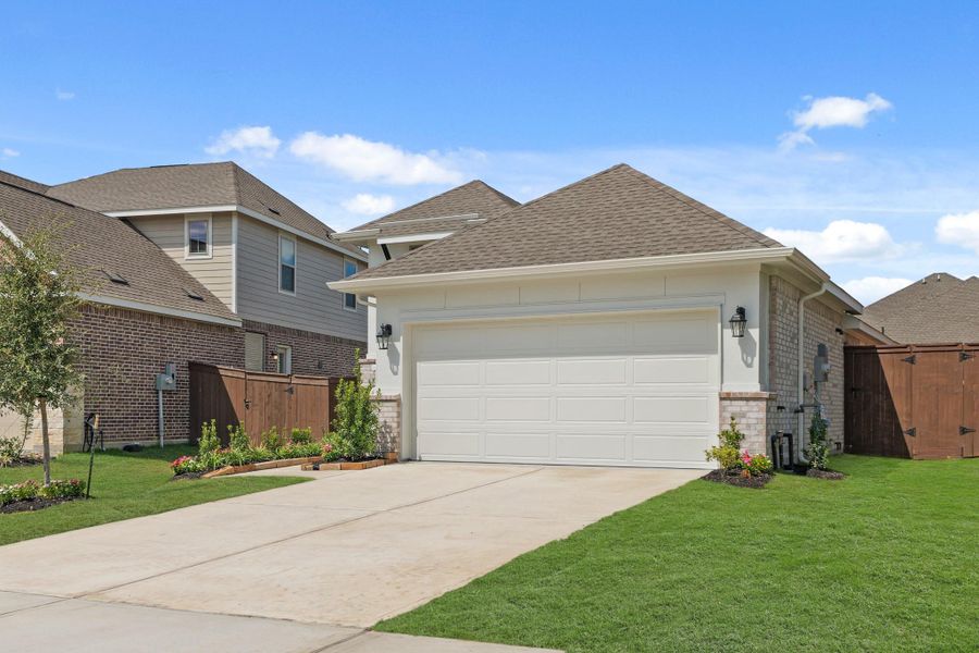 Front exterior of a new home in The Trails, New Caney, TX, highlighting curb appeal (Image 18). Front exterior of a new home in The Trails, New Caney, TX, highlighting curb appeal (Image 18).
