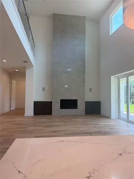 Great Room with 2-Story Tiled Fireplace with built-ins