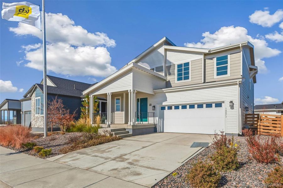 Front exterior of a new home in Legato, Commerce City, CO, highlighting curb appeal (Image 1).