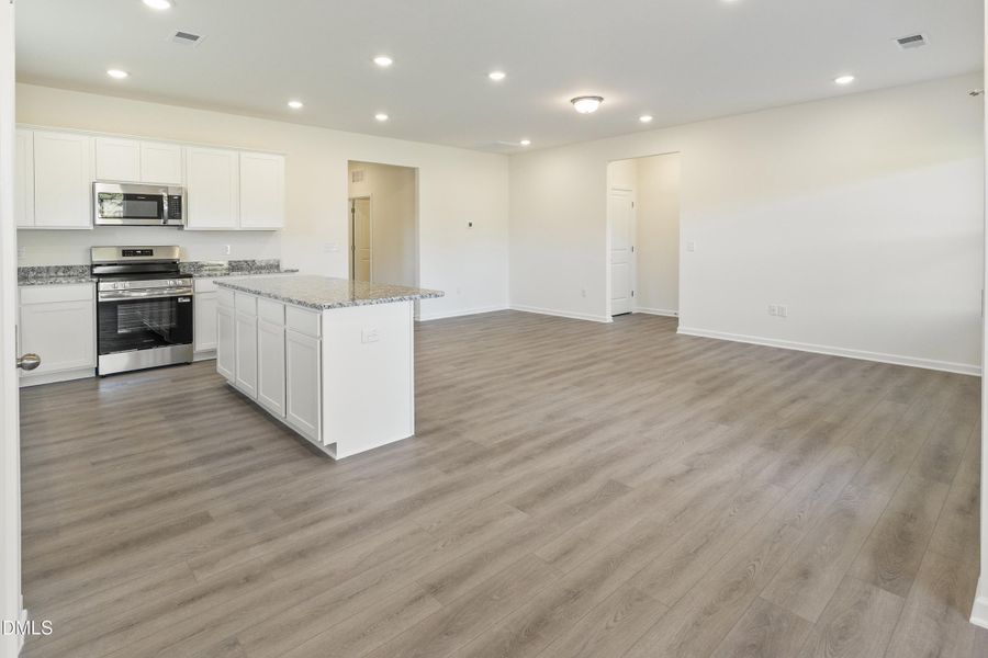 Kitchen flows to Family Room