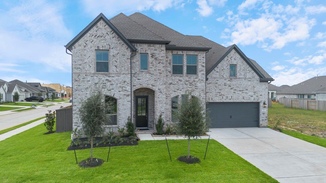 Front exterior of a new home in Coastal Point, League City, TX, highlighting curb appeal (Image 1). Front exterior of a new home in Coastal Point, League City, TX, highlighting curb appeal (Image 1).