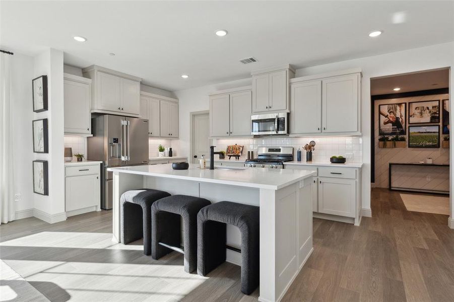 Gorgeous cabinetry paired with stylish finishes can be found in your new dream kitchen!