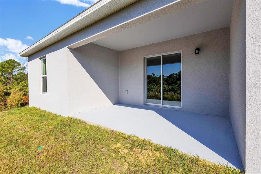 Exterior details and patio area of a home in Sebring Classic, Sebring (Image 15).