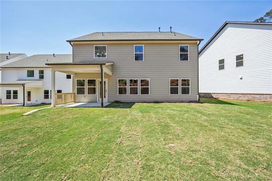 Exterior details and patio area of a home in Arbors at Richland Creek, Buford (Image 14).
