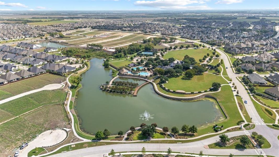 View of property location featuring a large body of water and nearby suburban area
