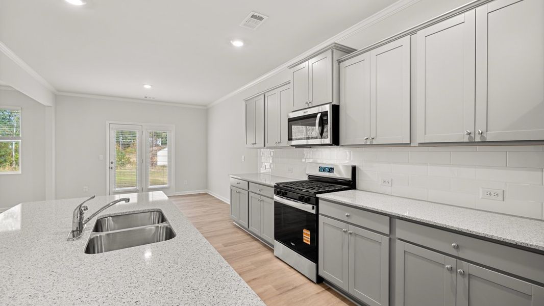 Representative furnished interior of a home built from the HALTON by D.R. Horton in Lost Creek, Dallas (Image 8).