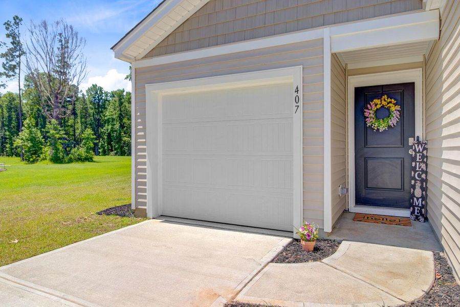 Front exterior of a new home in Stone Ridge, Moncks Corner, SC, highlighting curb appeal (Image 21).