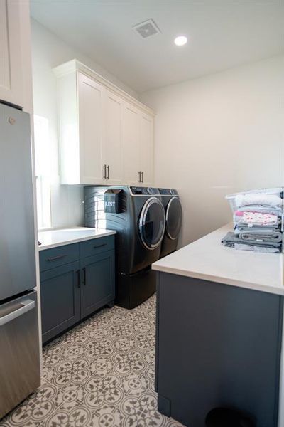 Laundry area featuring washing machine and dryer and recessed lighting Laundry area featuring washing machine and dryer and recessed lighting