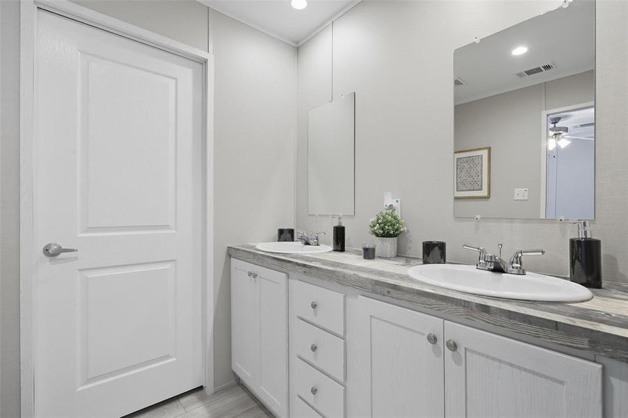 Full bathroom featuring double vanity, a ceiling fan, and recessed lighting Full bathroom featuring double vanity, a ceiling fan, and recessed lighting