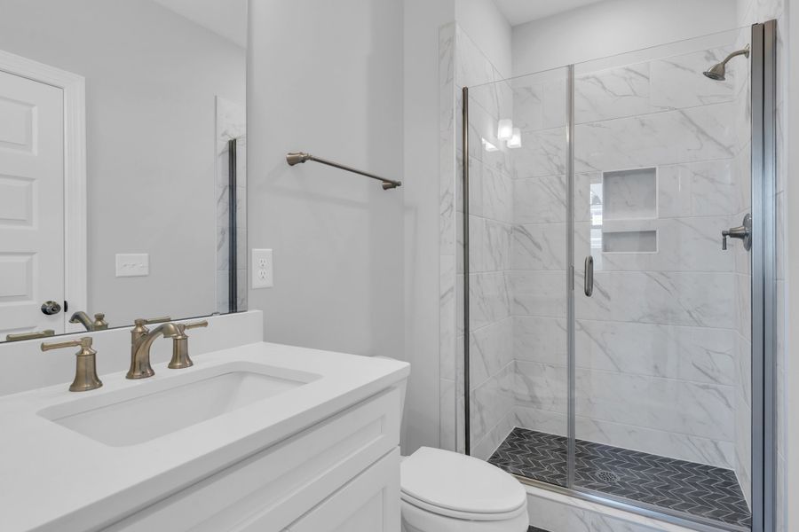 Representative furnished interior of a home built from the The Hampton by RobuckHomes in Windwater, Hampstead (Image 51).