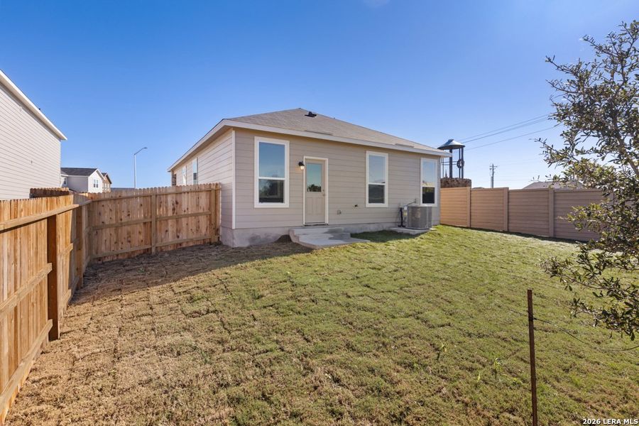 Exterior details and patio area of a home in Woodside Farms, Seguin (Image 3).