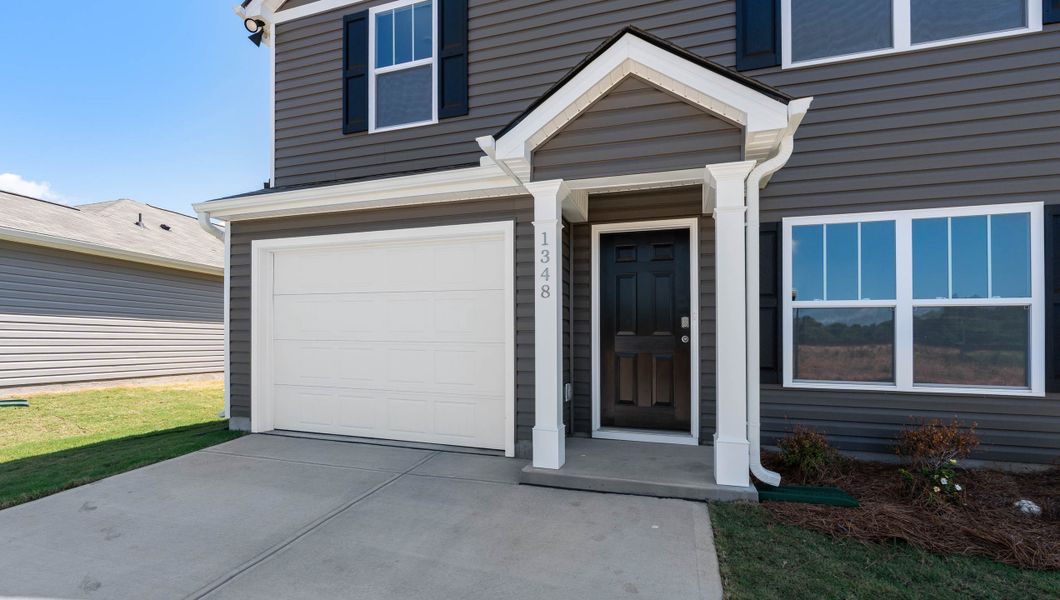 Front exterior of a new home in Harper Ridge, Roebuck, SC, highlighting curb appeal (Image 2).