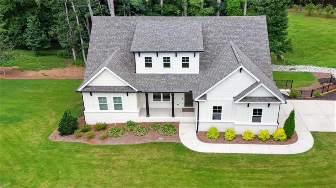 Front exterior of a new home in , Hoschton, GA, highlighting curb appeal (Image 27).