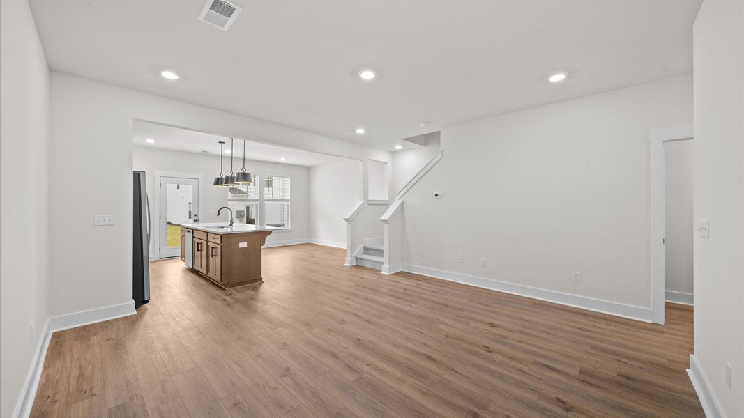 First-rate living space with tasteful hardwood floors and a functional open-concept design First-rate living space with tasteful hardwood floors and a functional open-concept design