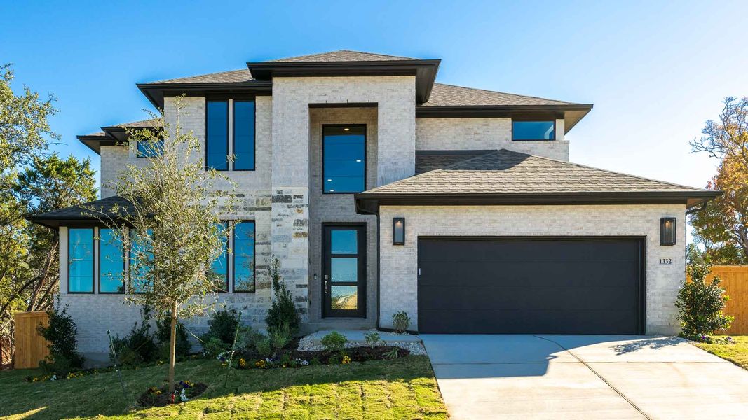 Front exterior of a new home in Parkside on the River, Georgetown, TX, highlighting curb appeal (Image 1). Front exterior of a new home in Parkside on the River, Georgetown, TX, highlighting curb appeal (Image 1).