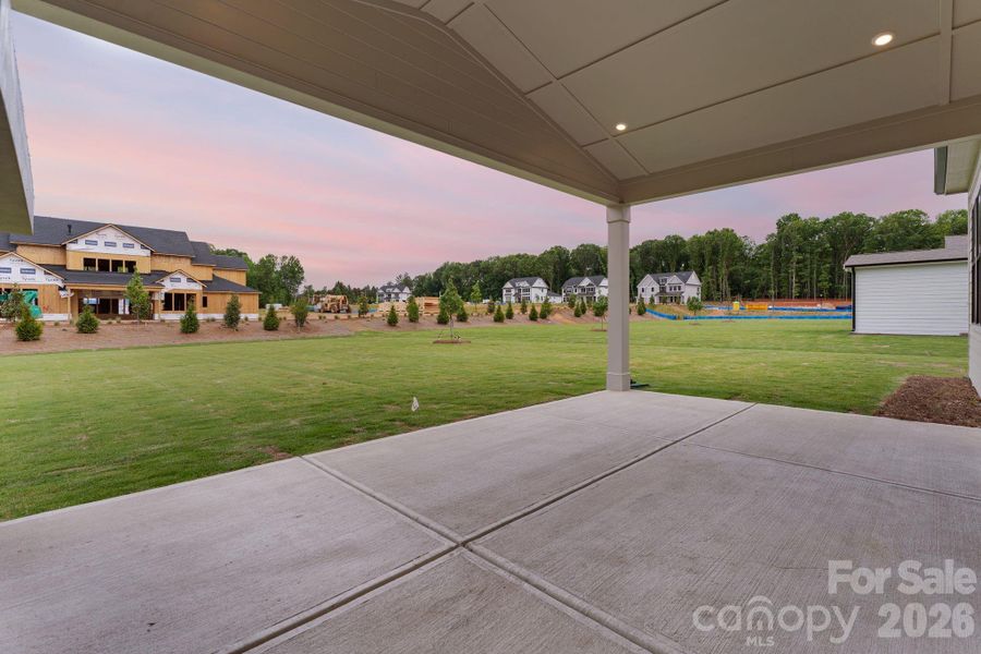 Exterior details and patio area of a home in Bluffs at Wesley Chapel, Waxhaw (Image 4).
