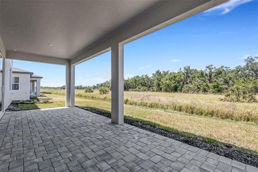 Exterior details and patio area of a home in Creeks Edge at Twin Rivers, Parrish (Image 4).
