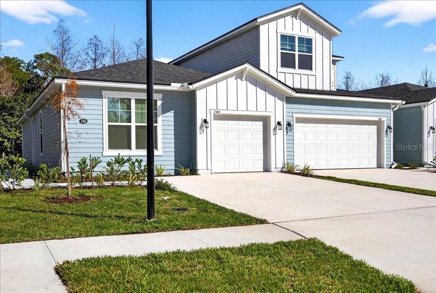 Front exterior of a new home in , Palm Coast, FL, highlighting curb appeal (Image 26).