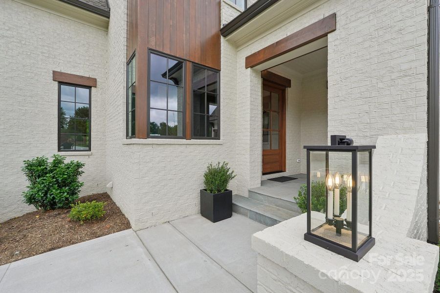 Exterior details and patio area of a home in Cardinal Crest, Weddington (Image 26).
