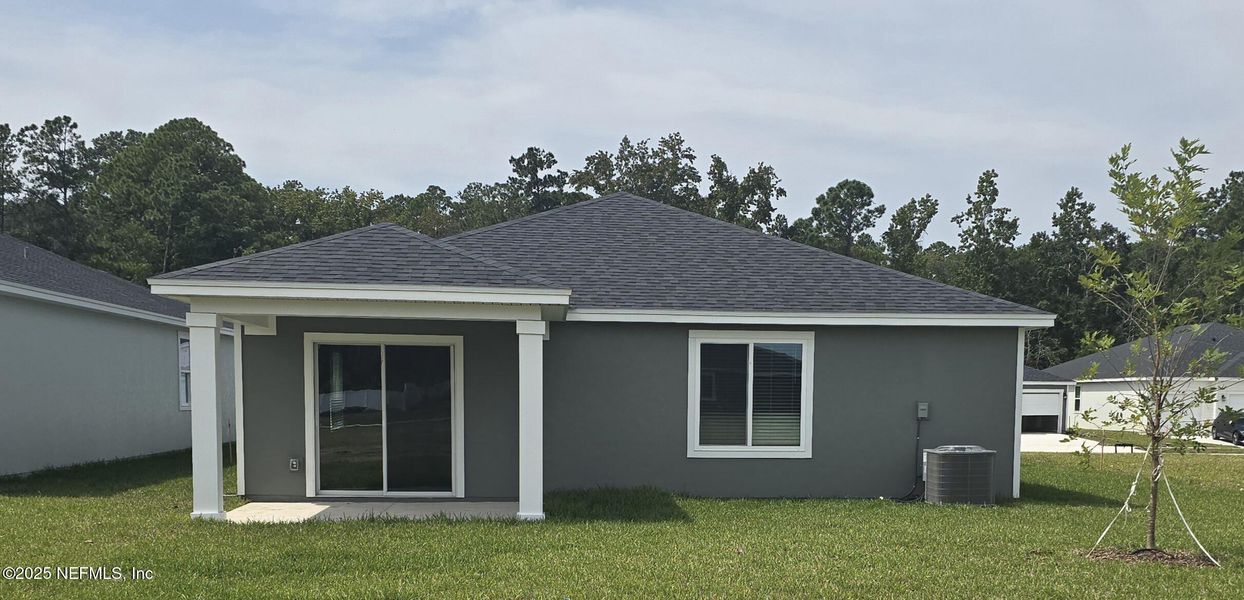 Front exterior of a new home in Azalea Creek, Jacksonville, FL, highlighting curb appeal (Image 15). Front exterior of a new home in Azalea Creek, Jacksonville, FL, highlighting curb appeal (Image 15).