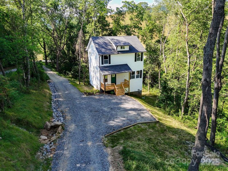Front exterior of a new home in , Waynesville, NC, highlighting curb appeal (Image 2). Front exterior of a new home in , Waynesville, NC, highlighting curb appeal (Image 2).