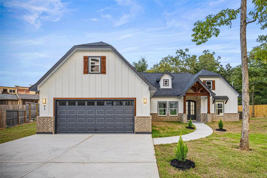Front exterior of a new home in , Conroe, TX, highlighting curb appeal (Image 18).