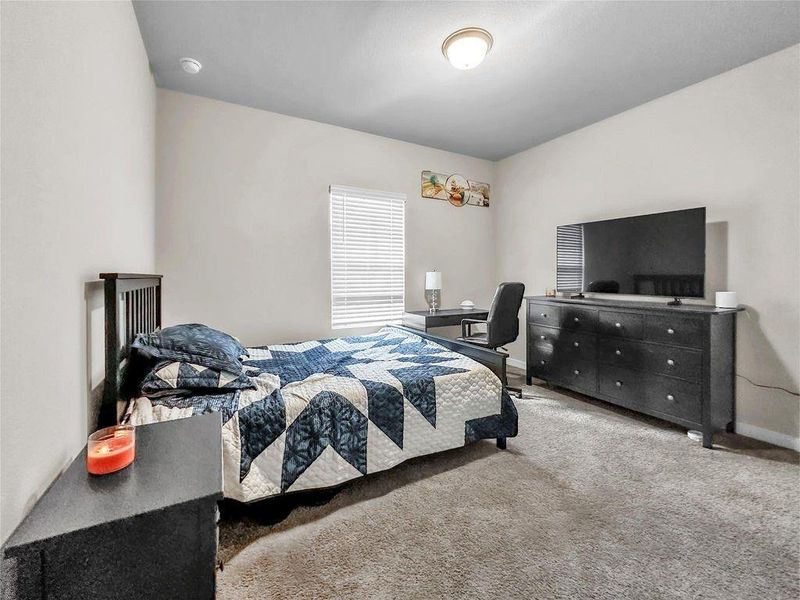 Well-sized secondary bedrooms with ample closet space and neutral finishes, complemented by clean and modern full bathrooms.