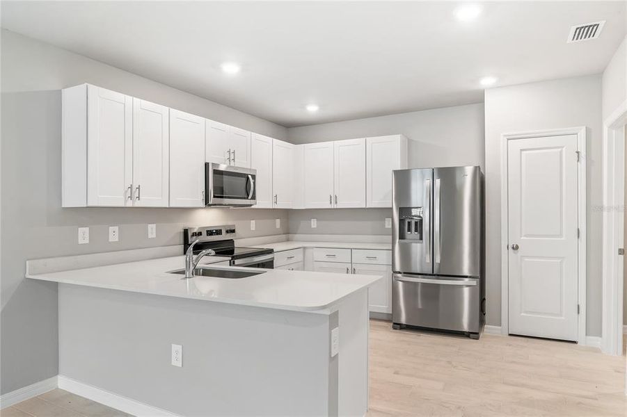 Furnished interior view inside a new home in Heritage Lake Park, Punta Gorda (Image 6).