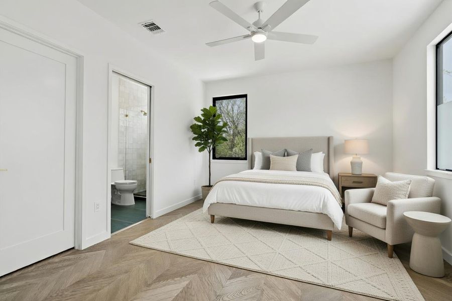 4th bedroom with parquet floors, a ceiling fan, and connected bathroom