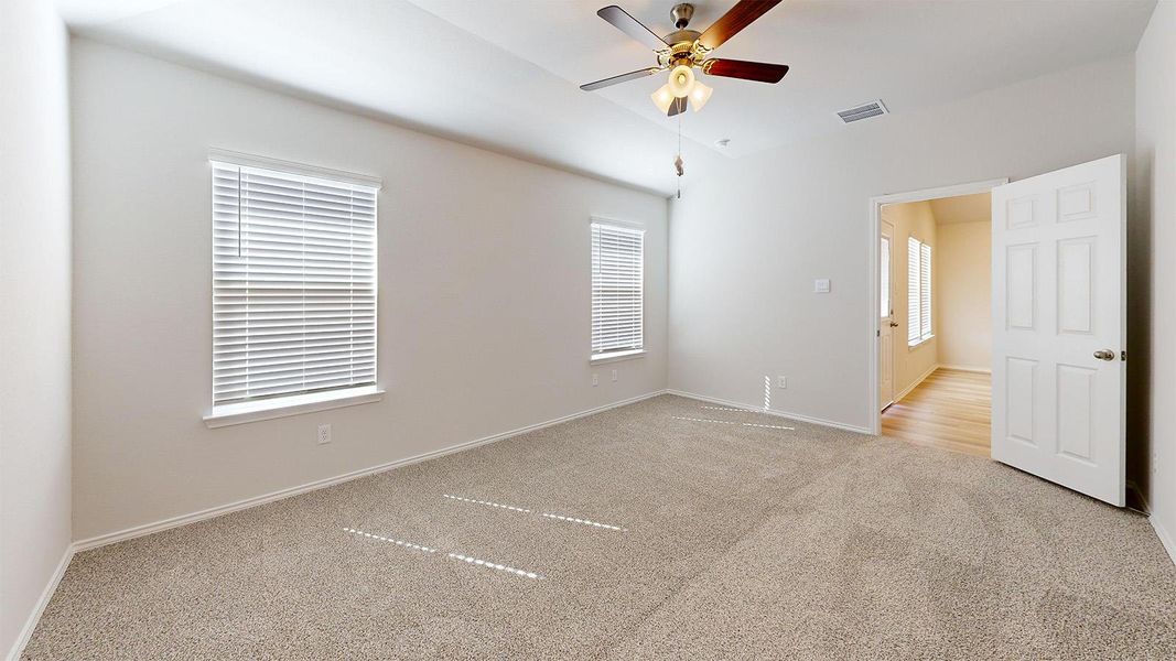 A spacious bedroom with a neutral palette and ample light awaits customization.