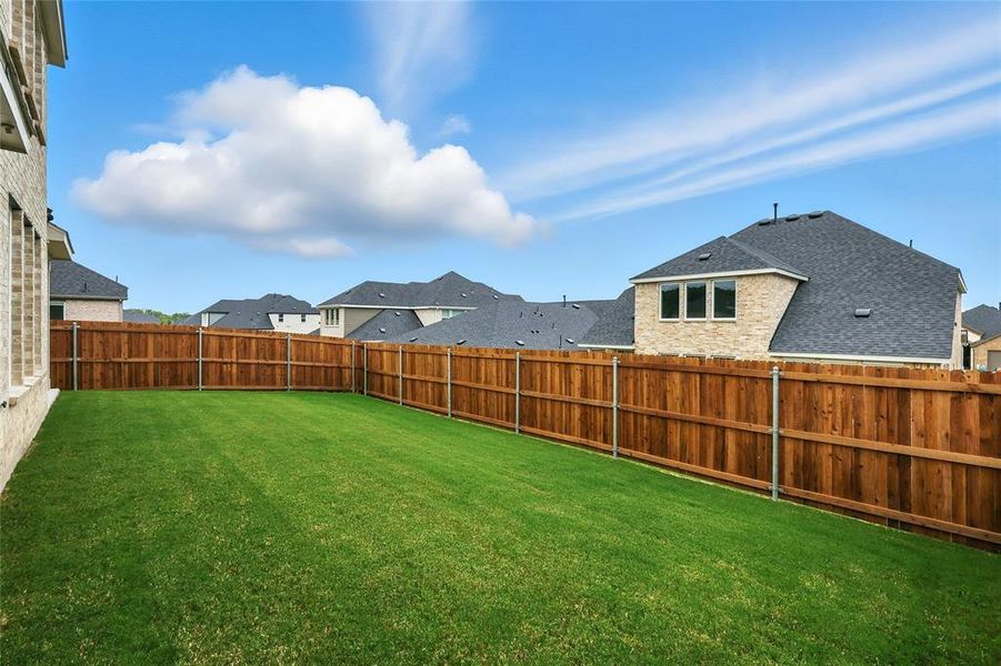 Fenced backyard featuring a residential view Fenced backyard featuring a residential view