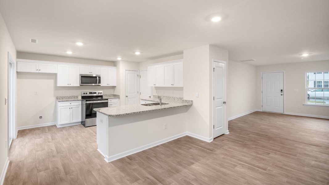 Furnished interior view inside a new home in Hobbs Farm, Ayden (Image 3).